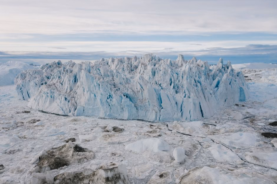 Majestic frozen glacier landscape captured from above, showcasing icy textures.