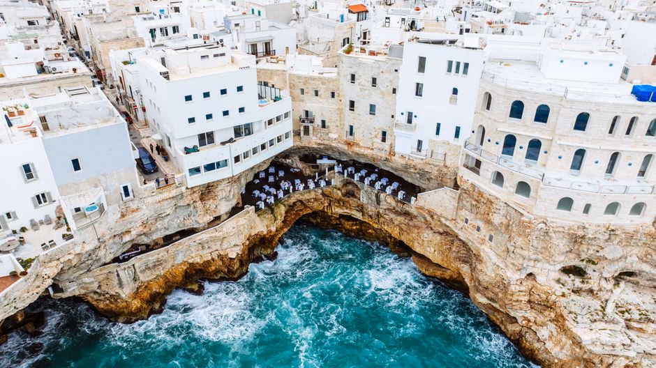Stunning cliffside hotel in Polignano a Mare, overlooking the vibrant Adriatic Sea.