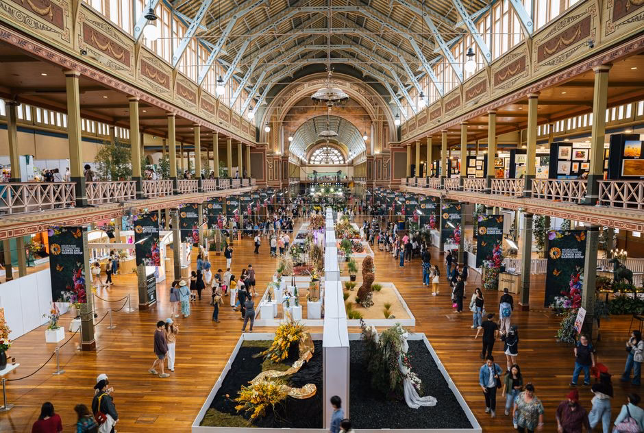 Vibrant event at Carlton's Royal Exhibition Building showcasing diverse art and floral displays.
