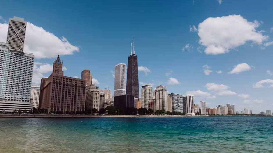 Stunning view of Chicago's skyline with Lake Michigan on a clear day featuring iconic skyscrapers.